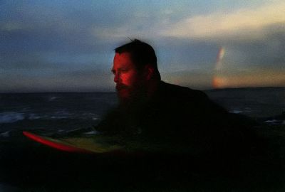 One Of Our Last Days In Nz, 30mph Offshore Evening, Fitzroy Beach.
Tom, evening glow with rainbow.
